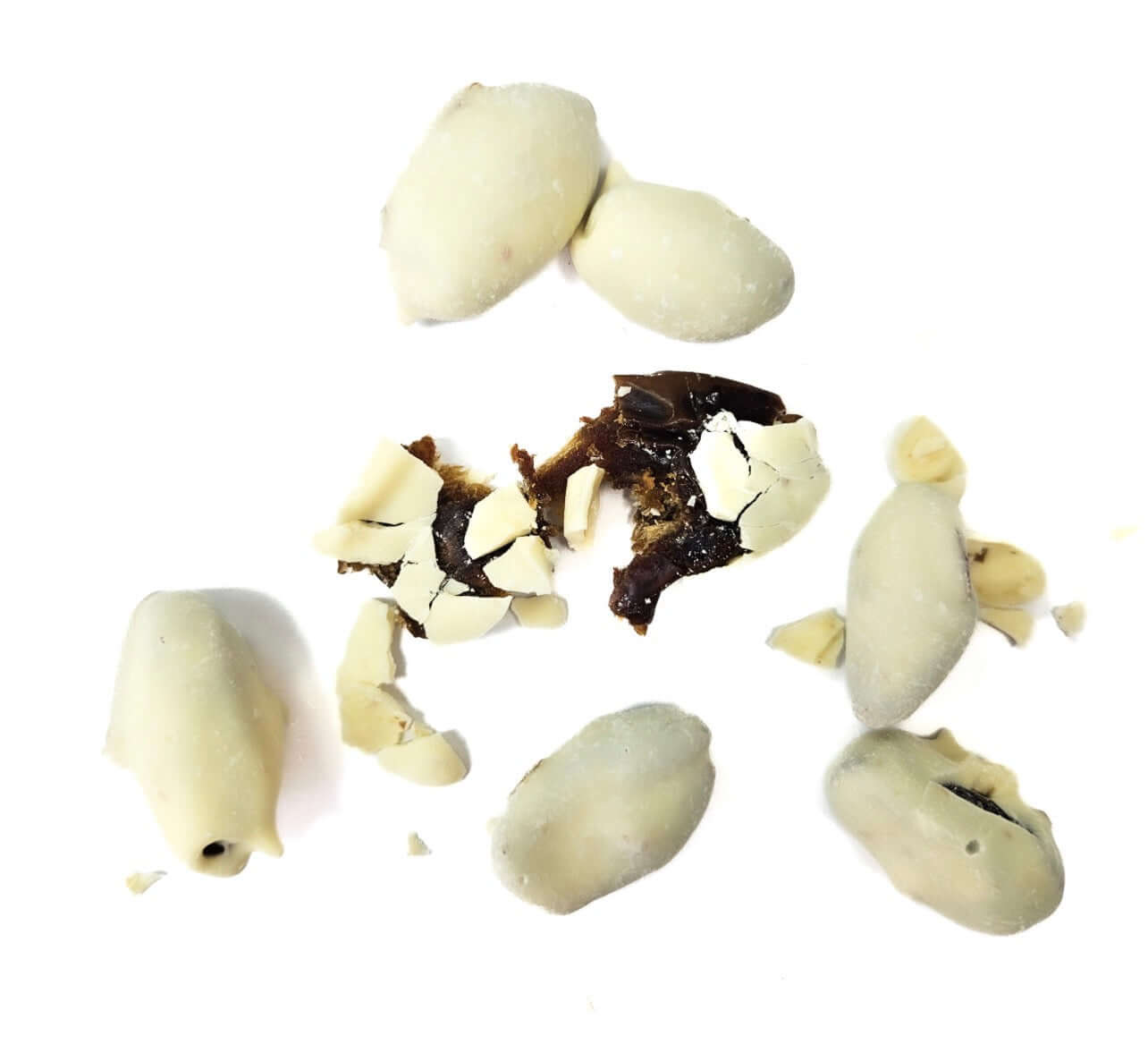 Yoghurt Coated Dates scattered with pieces revealing creamy yoghurt and soft dates.
