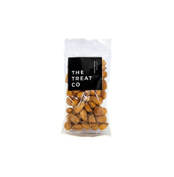 Chutney Corn Nuts in a clear package from The Treat Co, perfect for snacking anytime.