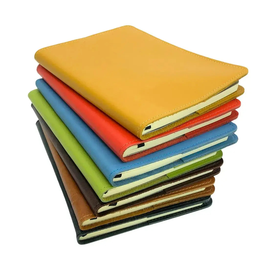 RUSTIK COLOURFUL LEATHER SLIP ON COVER + JOURNAL stacked in vibrant colors, showcasing variety for journaling.