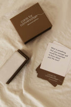 Cards for Conversation: Second Edition card set with thought-provoking questions on a soft background.