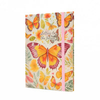 Letters to the future journal with colorful butterflies and floral designs on the cover.