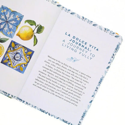 Open pages of the La Dolce Vita Vision Journal showcasing vibrant illustrations and inspiring text.