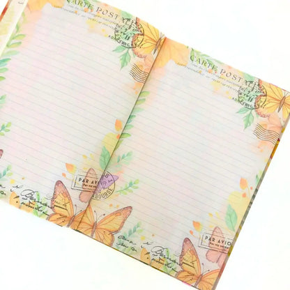 Letters to the future journal open pages with floral and butterfly designs for journalling.
