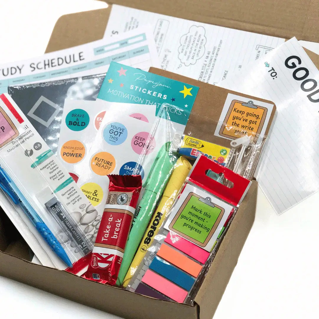 Exam Care Package filled with study schedule, stickers, motivational tools, and snacks for effective exam preparation.