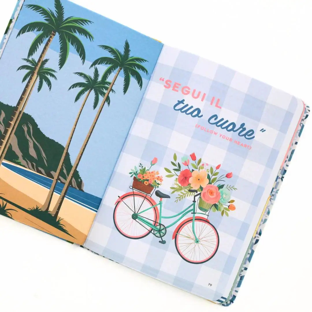 La Dolce Vita Vision Journal open page with tropical illustration and a bicycle featuring flowers.