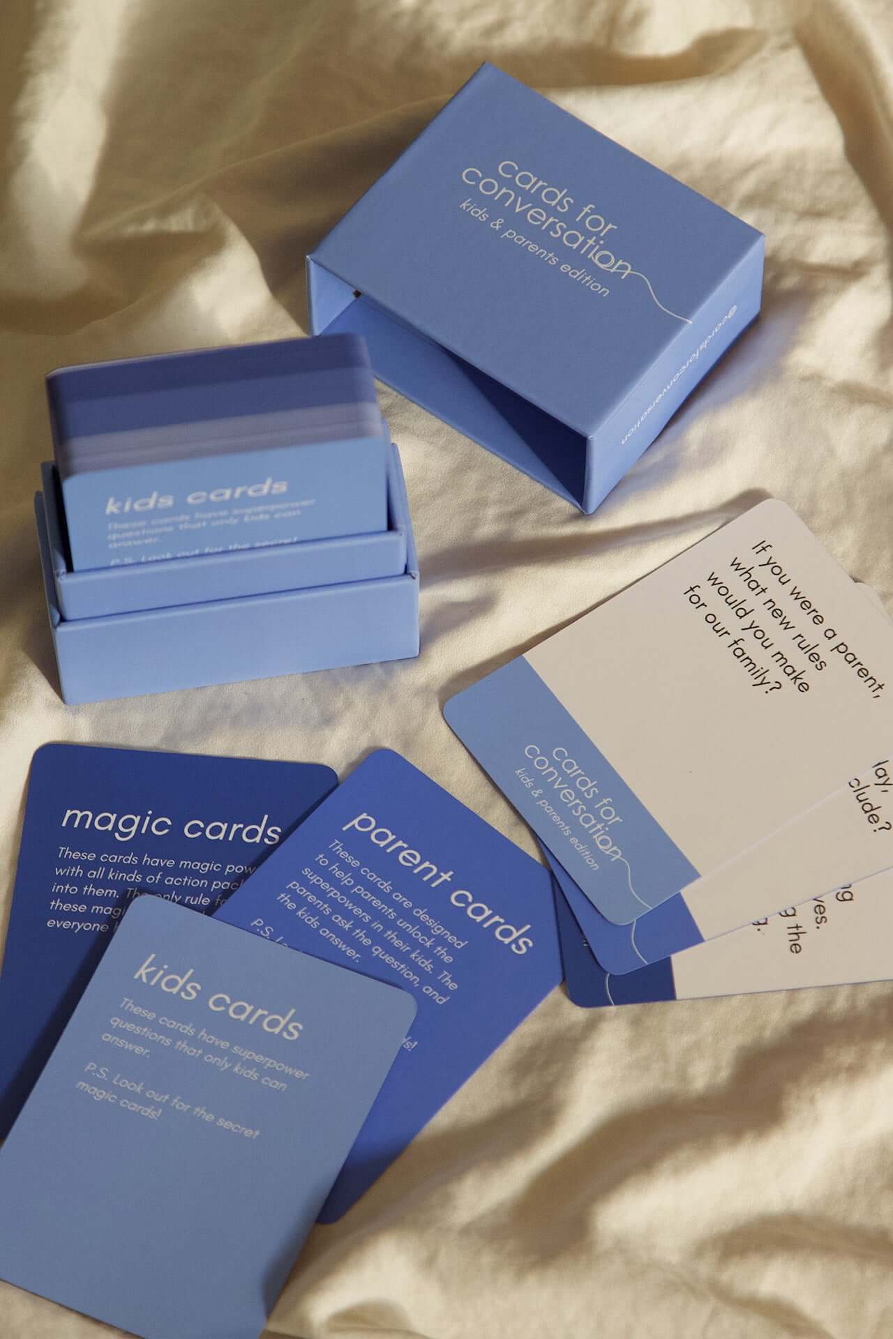Cards for Conversation: Kids & Parents Edition, featuring blue prompt cards for engaging family discussions.