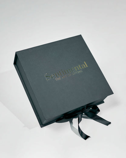 Nice to Treat You Giftbox elegantly presented with a black box adorned with a ribbon for gifting.