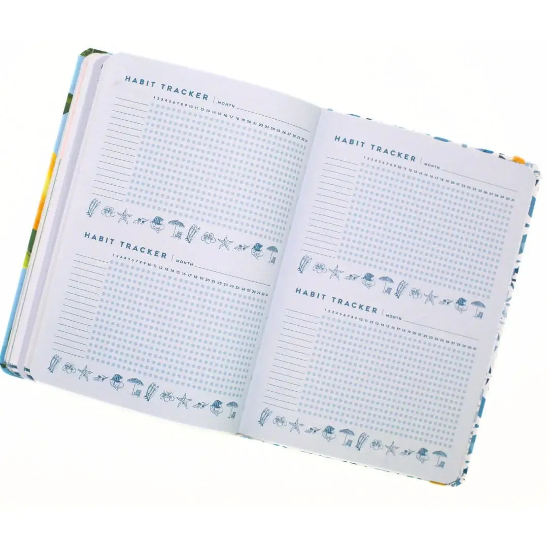 La Dolce Vita Vision Journal open to habit tracker pages for mindful living and personal growth.