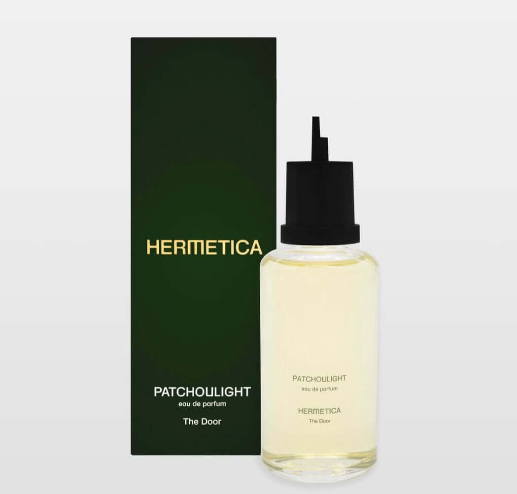 Hermetica Patchoulight Eau de Parfum Refill bottle and box packaging on a neutral background.