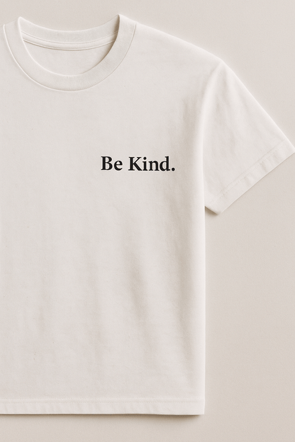 Be Kind T-shirt featuring a minimalist design with the text 'Be Kind.' printed on a soft, white fabric.